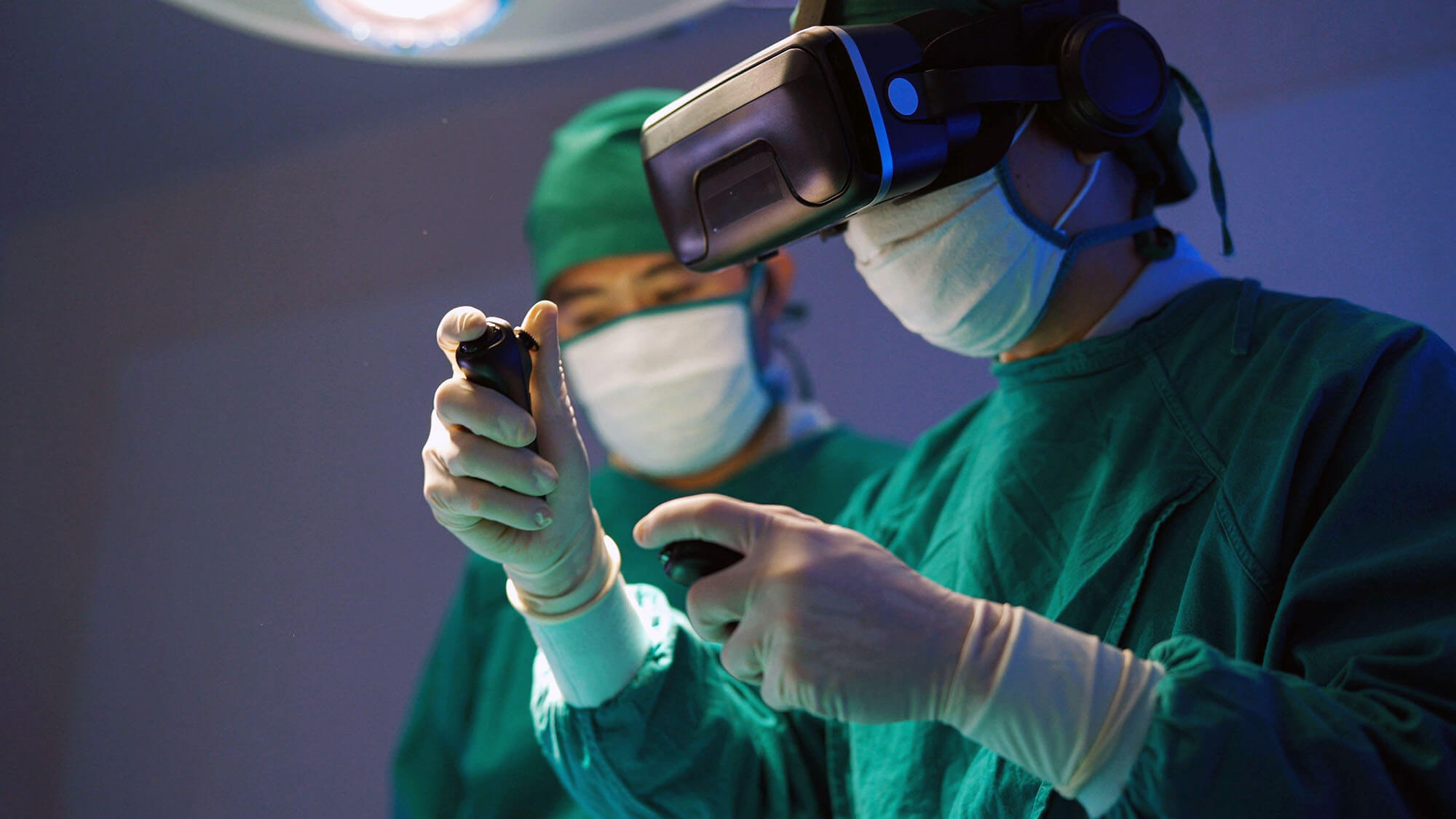 Professional surgeons in uniform and VR headset performing operation on patient in modern clinic